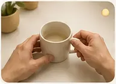 First-person human video of hands holding a cup.